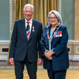 C. Michael O’Brian is standing next to the Governor General.