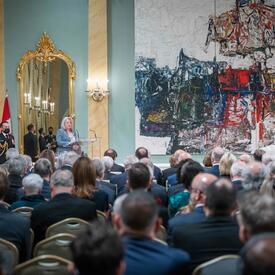 The Governor General is addressing the audience in the Rideau Hall ballroom.