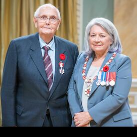 T. Robert Beamish is standing next to the Governor General.