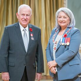 James Casey is standing next to the Governor General.