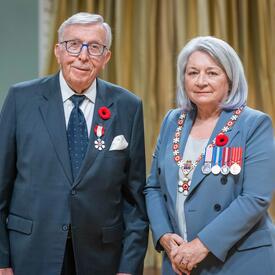 William Fast is standing next to the Governor General.