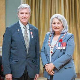 Mark Byron Godden is standing next to the Governor General.