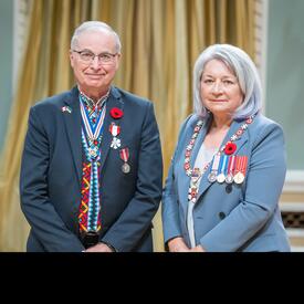 Steve E. Hrudey is standing next to the Governor General.