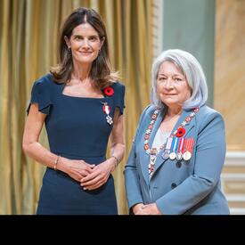 Isabelle Marcoux is standing next to the Governor General.