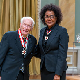 Frank Joseph Hayden is standing next to The Right Honourable Michaëlle Jean.