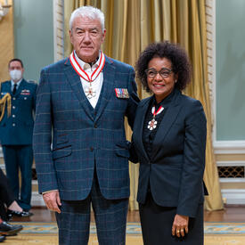 Tom Jackson is standing next to The Right Honourable Michaëlle Jean.