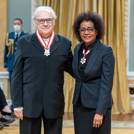 André Ménard is standing next to The Right Honourable Michaëlle Jean.