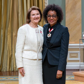 Cristina Amon is standing next to The Right Honourable Michaëlle Jean.