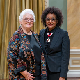 B. Lynn Beattie is standing next to The Right Honourable Michaëlle Jean.