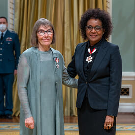 Judy Birdsell is standing next to The Right Honourable Michaëlle Jean.
