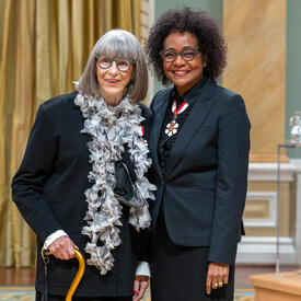 Marilyn Brooks-Coles is standing next to The Right Honourable Michaëlle Jean.