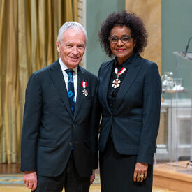 Phillip Crawley is standing next to The Right Honourable Michaëlle Jean.
