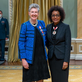 Suzanne Labarge is standing next to The Right Honourable Michaëlle Jean.