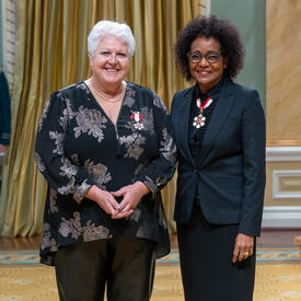 Maria Labrecque-Duchesneau is standing next to The Right Honourable Michaëlle Jean.