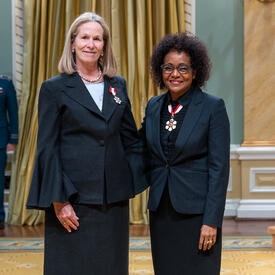 Jennifer Tory is standing next to The Right Honourable Michaëlle Jean.