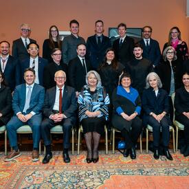 A group photo of recipients of the Governor General’s Architecture & Landscape Architecture awards. Governor General Simon is seated in the centre of the group.