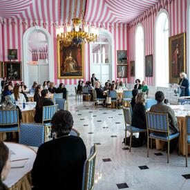 A group of women at round tables in the Tent Room at Rideau Hall. 