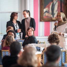 A group of women engage in conversation in the Tent Room at Rideau Hall. 