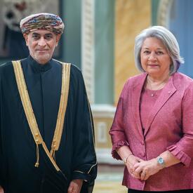 Governor General Simon is standing next to His Excellency Moosa Hamdan Moosa Al Tai.