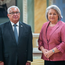 Governor General Simon is standing next to His Excellency Gerald M. Zackios.