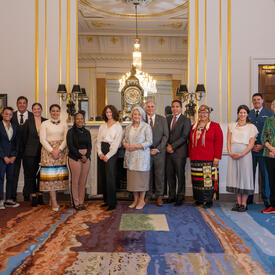 Governor General Mary Simon stands with members of the Canadian Delegation for the Coronation of His Majesty King Charles III