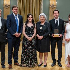 Governor General Marie Simon poses with Colin Freeze, Grant Robertson, Joe Friesen, Robyn Doolittle and Susan Krashinsky Robertson