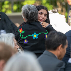 Two people hug during the ceremony