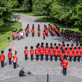 Ceremonial guard standing in front of Rideau Hall, awaiting the arrival of Governor General Marie Simon