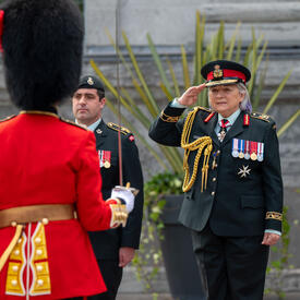 Governor General Mary Simon salutes the Commander of the Ceremonial Guard. She is wearing a Canadian Armed Forces army uniform.