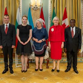 Governor General Marie Simon stands with the new heads of missions