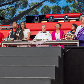Indigenous members perform a cultural ritual