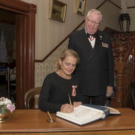After the presentation, she signed the Lieutenant Governor’s guest book. 