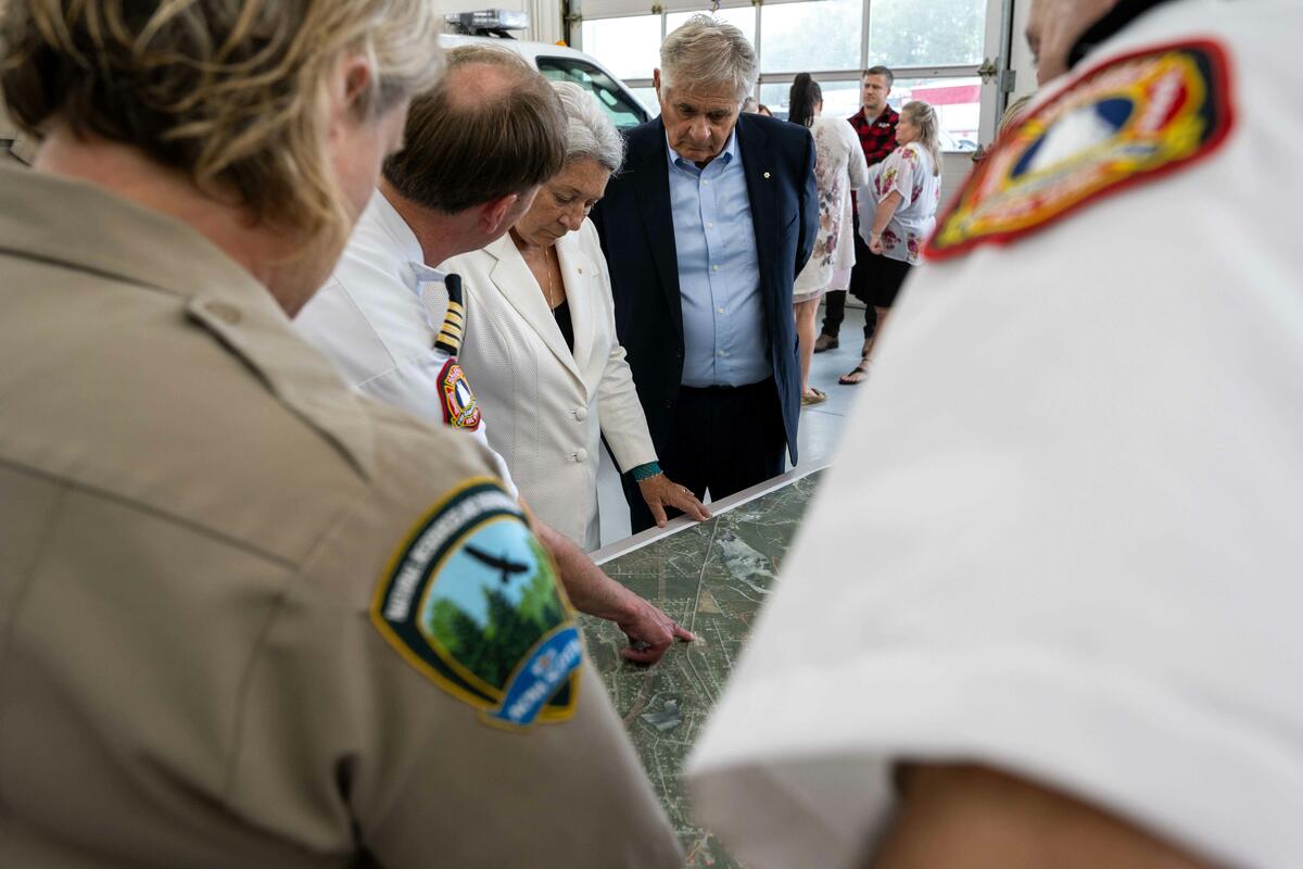 Governor General Mary Simon looks at a map