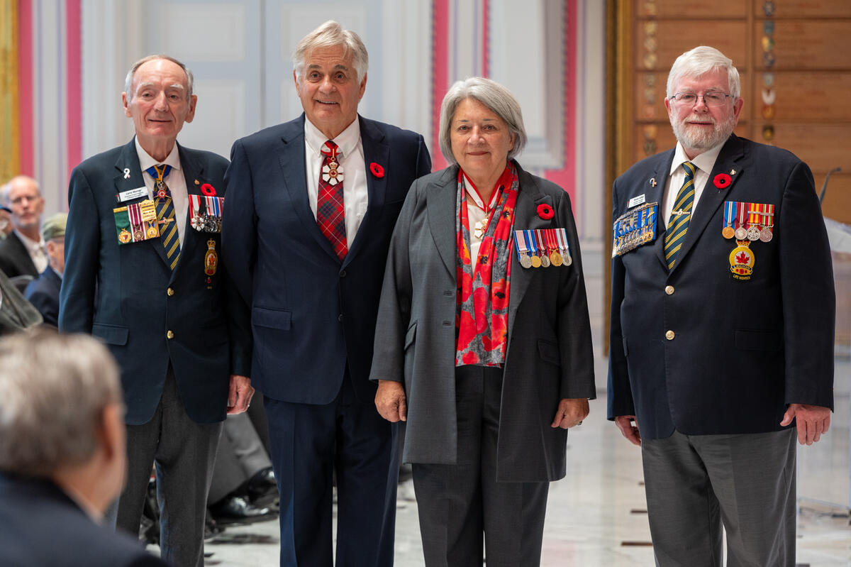 Governor General Mary Simon stands with Mr. Whit Fraser, Mr. Bruce Julian and Mr. Larry Murray