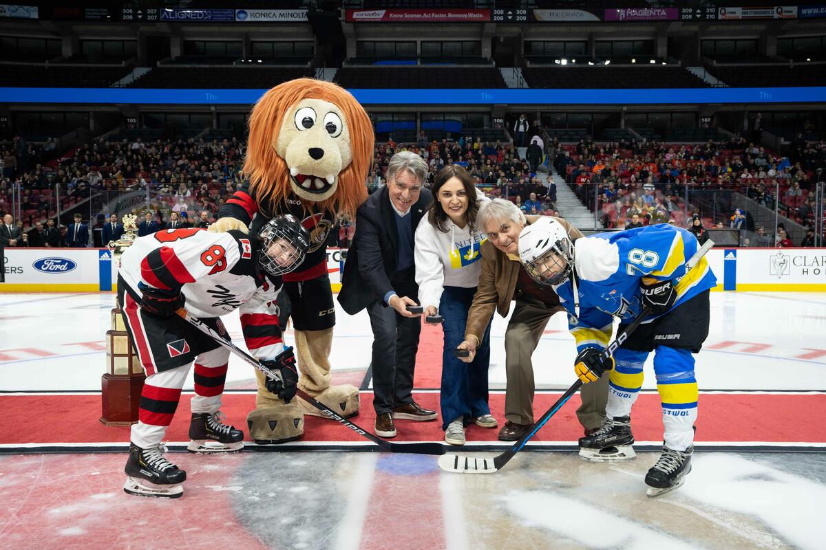 His Excellency Whit Fraser, joins Her Excellency Yuliya Kovaliv, Ambassador of Ukraine, and Mr. Murray MacDonald for the ceremonial puck drop.