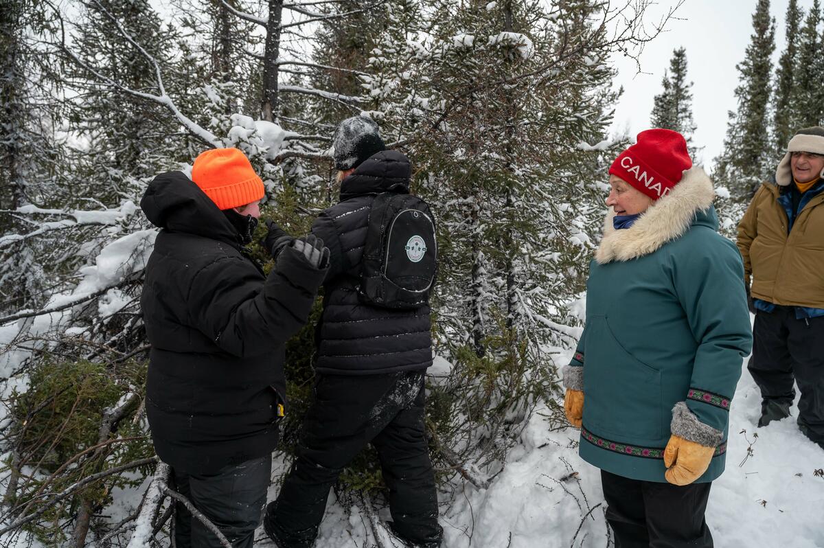 Governor General Mary Simon watches Junior Rangers build shelters