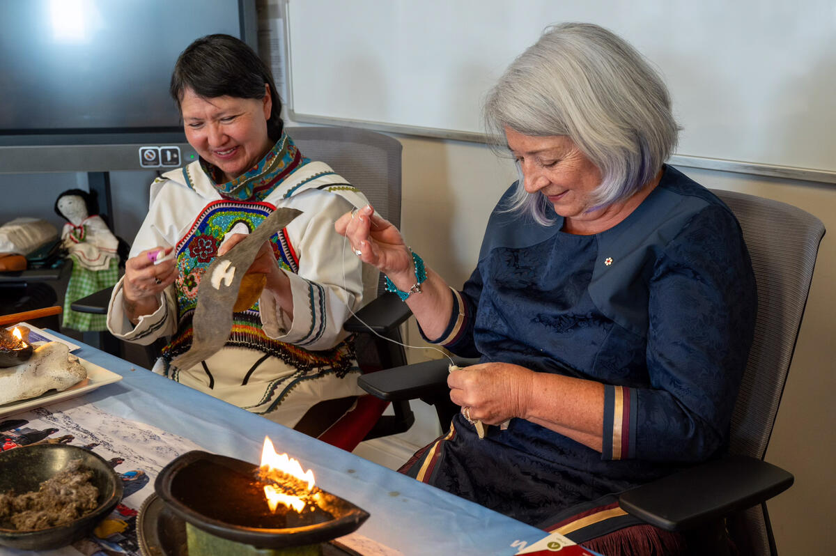 Governor General Mary Simon has a needle in hand as she sews a piece of fur