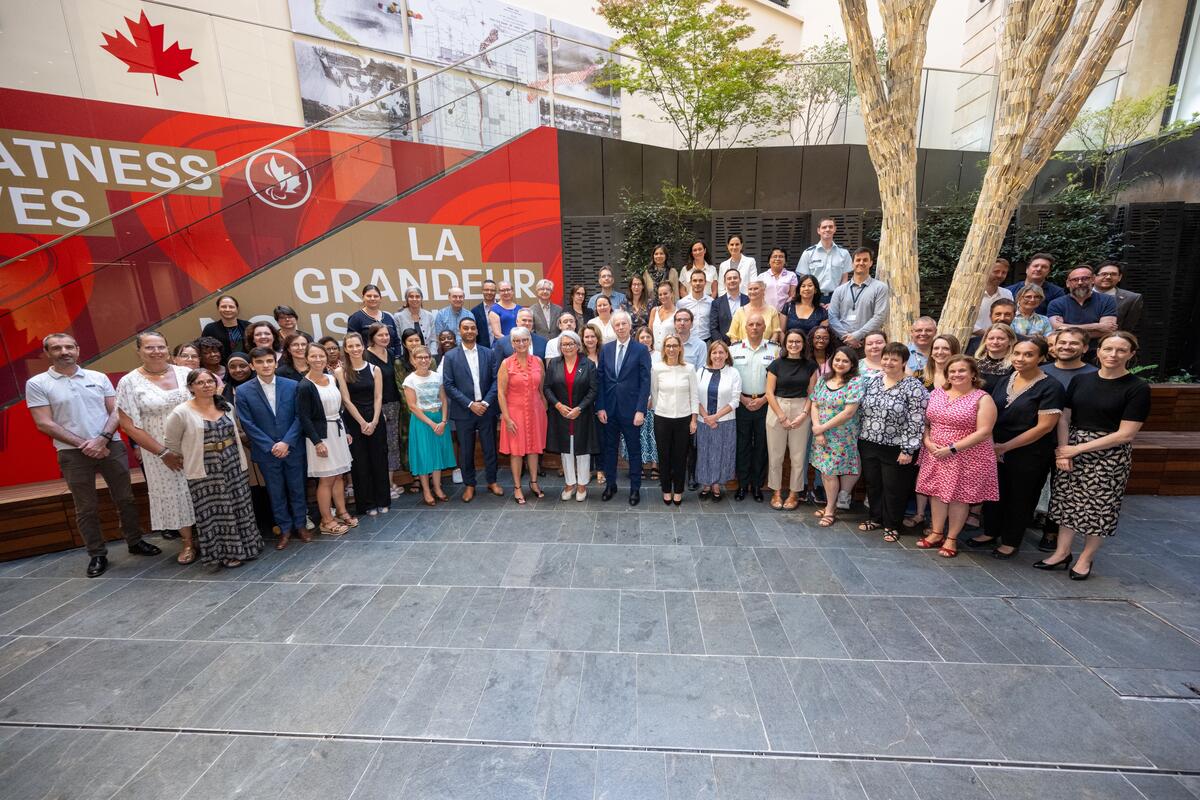 The Governor General Mary Simon and the Ambassador of Canada to France stand among a large group of people.