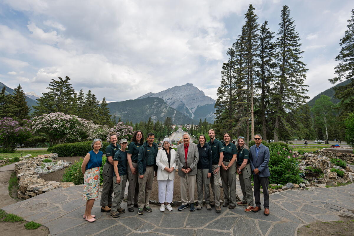 Their Excellencies posing with a group of people at Banff National Park.