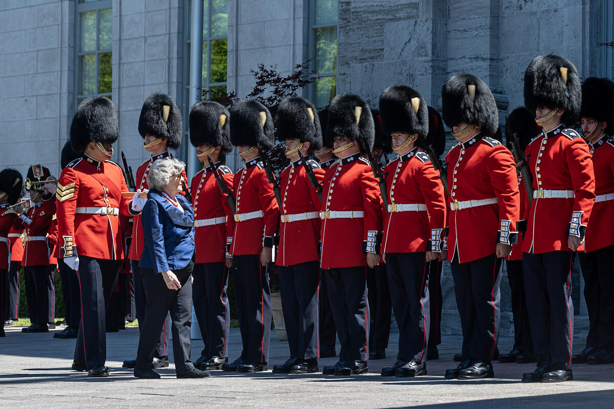 Governor General Louise Arbour walking by the Footguards.