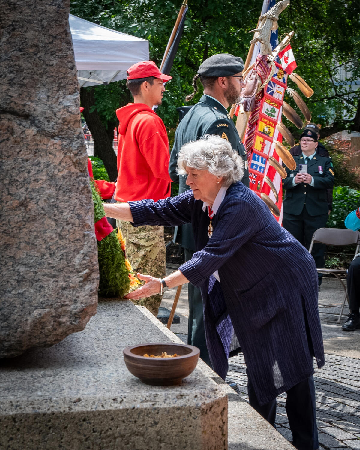 Governor General Arbour placing a wreath at the base of the National Aboriginal Veterans Monument in Ottawa.