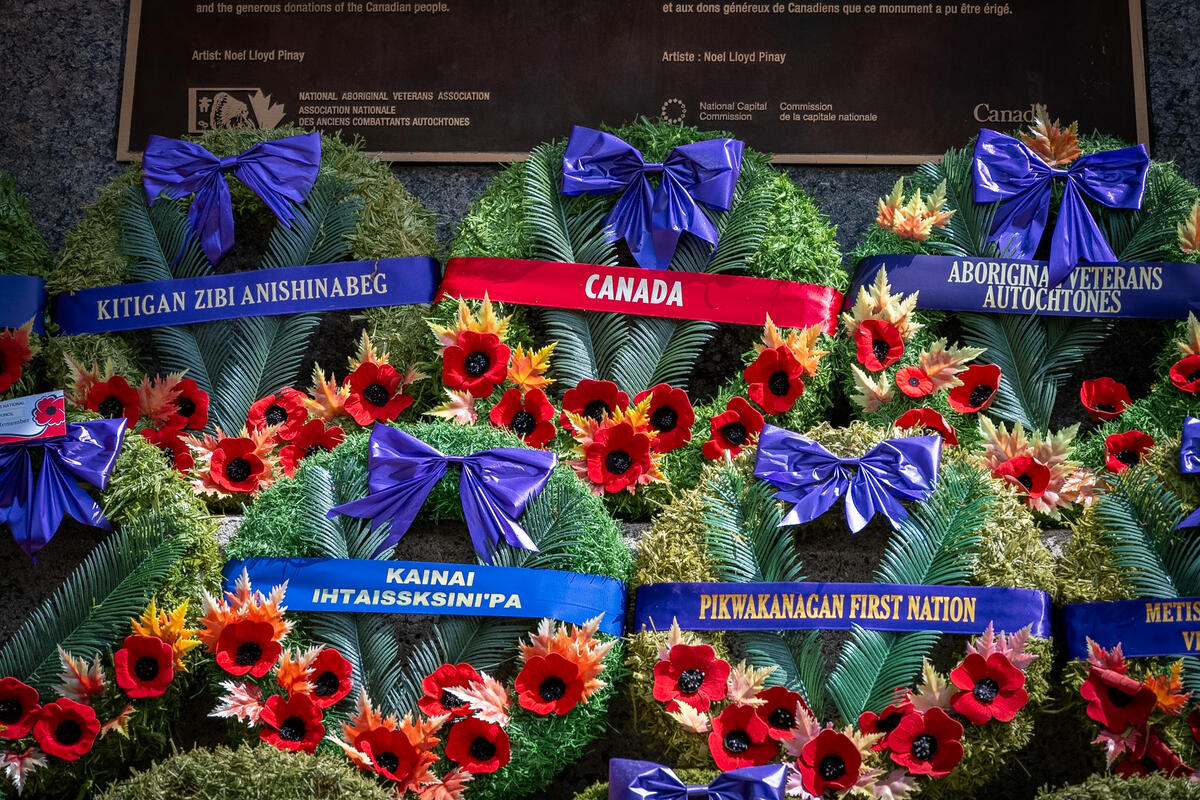 Several wreaths placed at the base of the National Aboriginal Veterans Monument in Ottawa. 