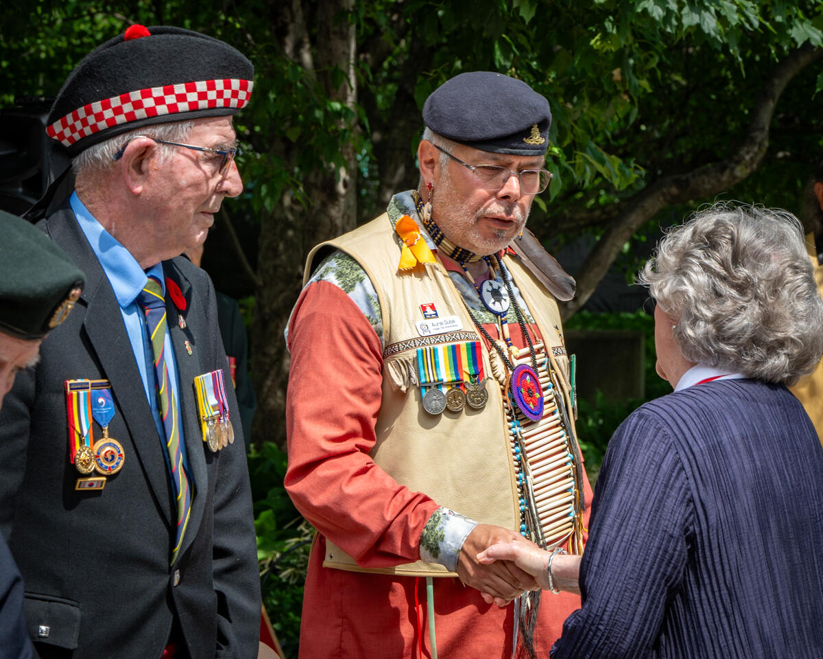 Governor General Arbour shaking hands with veterans at the ceremony to mark the 25th anniversary of the unveiling of the National Aboriginal Veterans Monument in Ottawa.