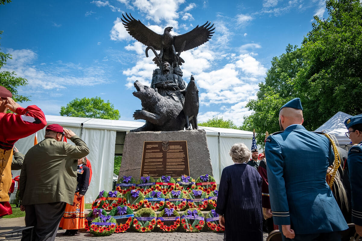 Governor General Arbour and others looking at the wreaths placed before the National Aboriginal Veterans Monument in Ottawa.