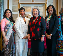 Governor General Simon poses for the photo with five other women.