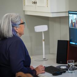 The Governor General participates in a video call on her computer.