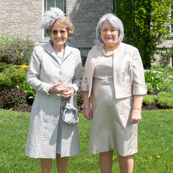 The Governor General is standing next to Her Royal Highness Princess Margriet of the Netherlands outside of Rideau Hall.