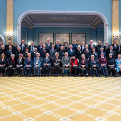 Governor General Mary Simon sits with the recipients