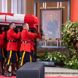 RCMP officers enter with the casket of the Right Honourable Brian Mulroney