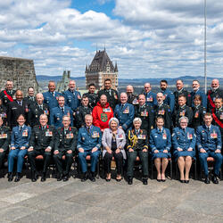 Governor General Mary Simon with Order of Military Merit recipients. They are outside of the Citadelle.